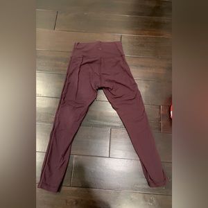 Lululemon cropped leggings with mesh side in plum color